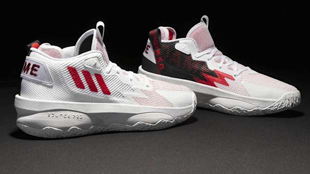 White, red, black Adidas Dame shoes.
